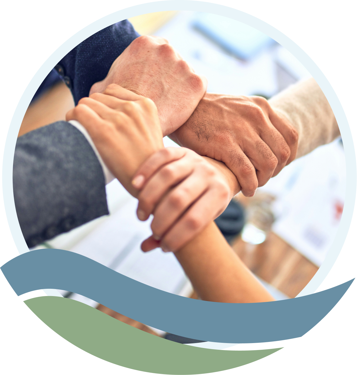 Four people joining hands and forearms together in a show of unity and support